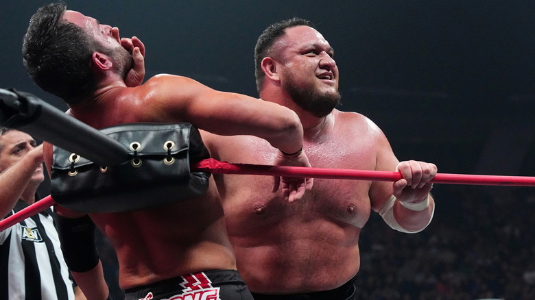 Samoa Joe chopping Roderick Strong