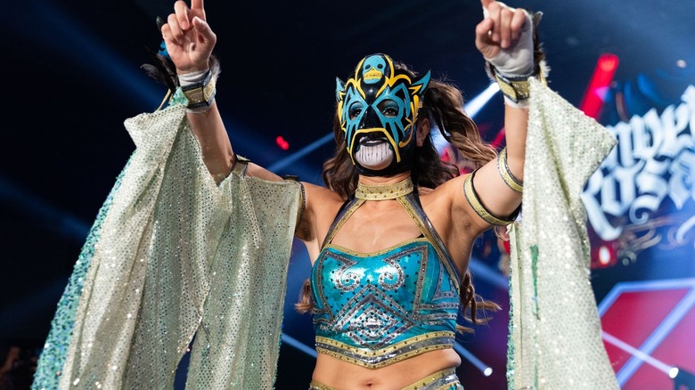 Masked Thunder Rosa pointing up