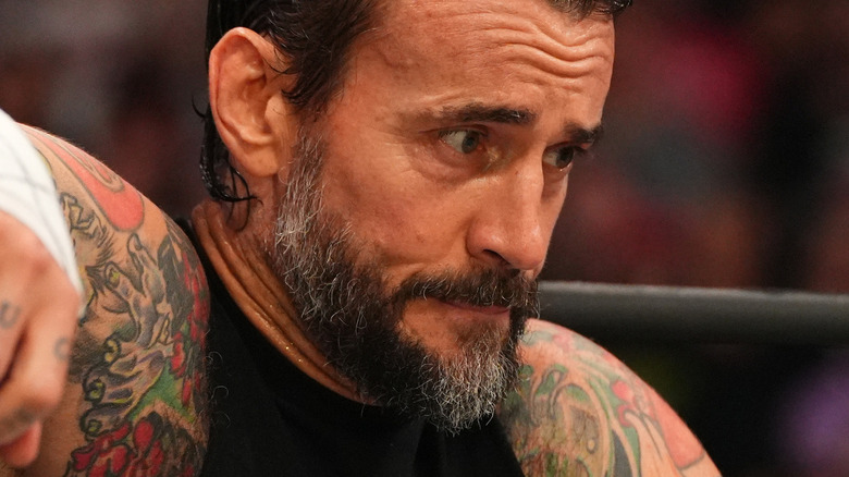 CM Punk sitting in the corner