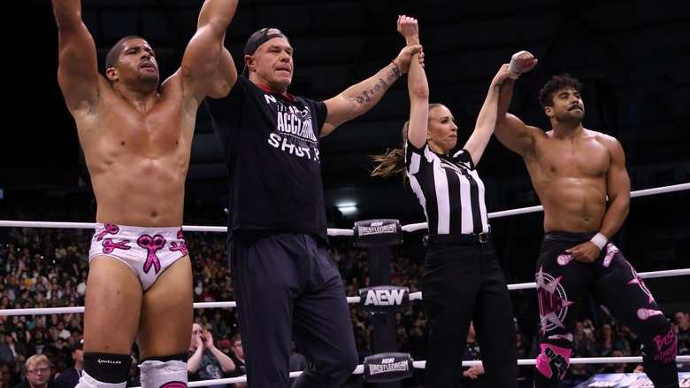 The Acclaimed celebrate in the ring with Billy Gunn and referee Aubrey Edwards at AEW WrestleDream.