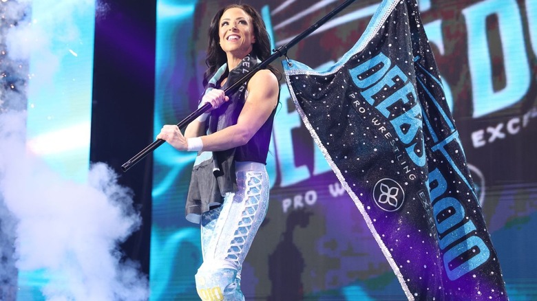 Serena Deeb with a flag
