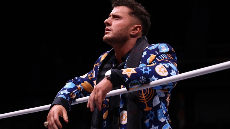 MJF leaning on the ropes in his Channukah jacket on "AEW Dynamite."