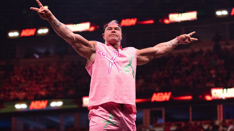 Billy Gunn posing in a pink outfit