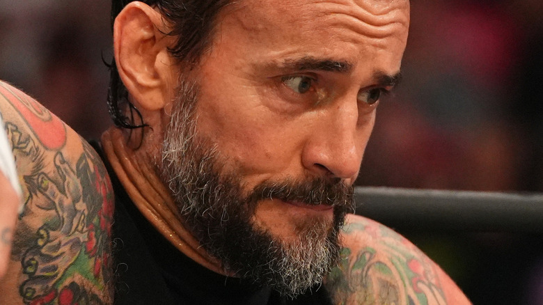 CM Punk sitting in the corner