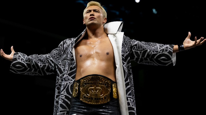 Kazuchika Okada posing with his arms outstretched