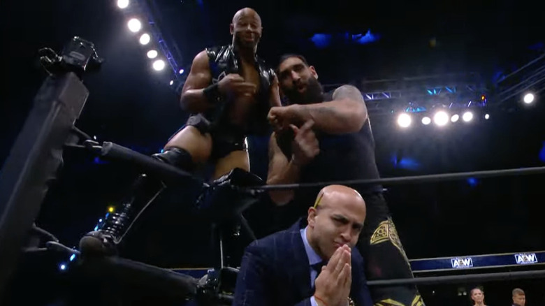 Lethal, Singh, and Dutt posing in the ring