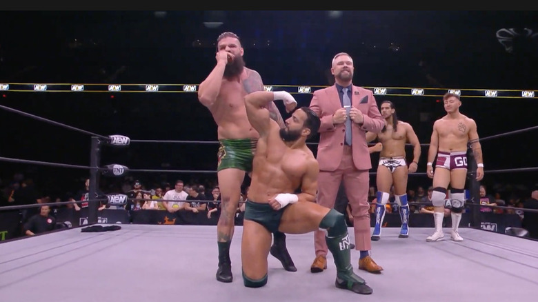 Nese and Woods posing in the ring