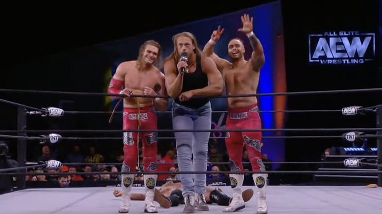 Morrisey and The Gunns posing in the ring