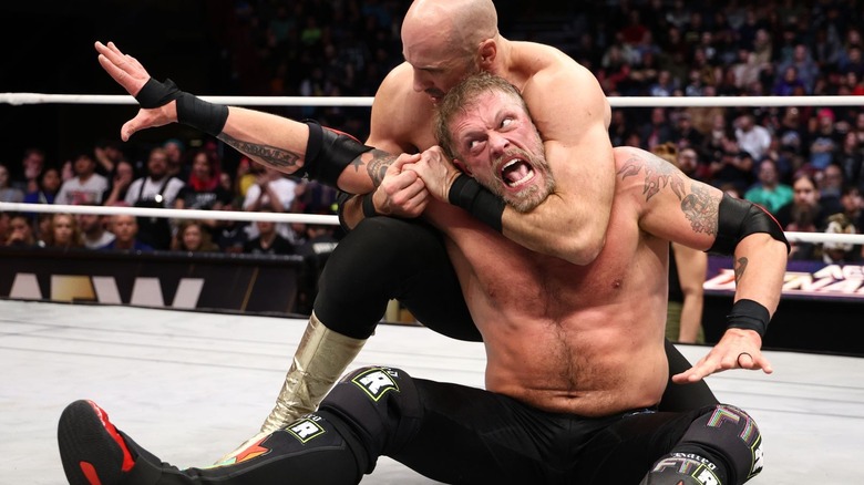 Claudio Castagnoli with Cope in a headlock on "AEW Dynamite."