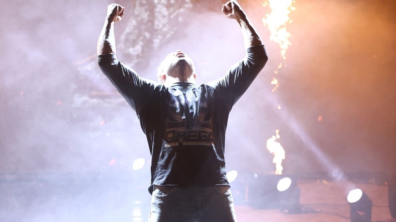 Kenny Omega poses on the ramp as pyro goes off on "AEW Dynamite."