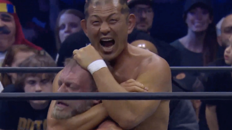 Minoru Suzuki choking out Adam Copeland