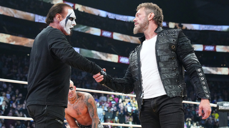 Adam Copeland shaking Sting's hand