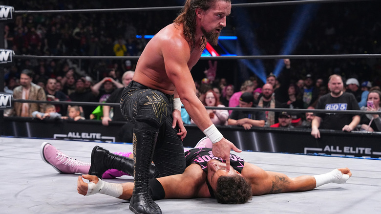 Jay White puts his finger gun to the head of MJF