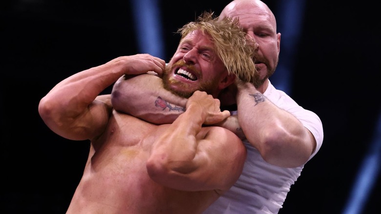 Jon Moxley choking out Orange Cassidy from behind on "AEW Dynamite"