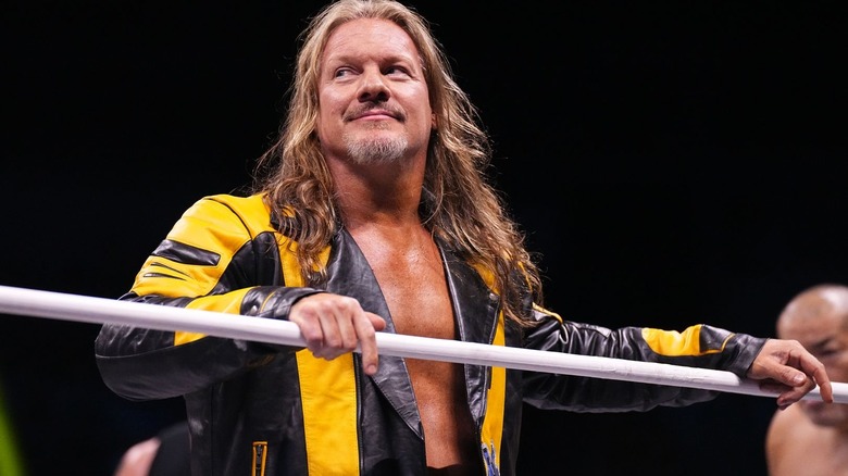 Chris Jericho smiling as he leans on the ropes on "AEW Dynamite."