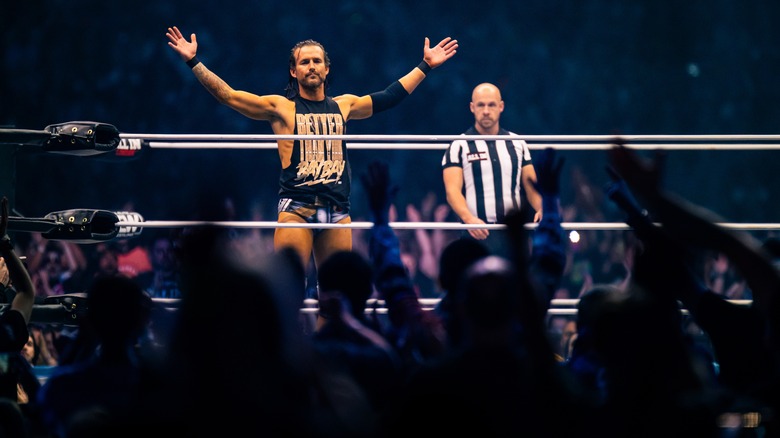 Adam Cole poses