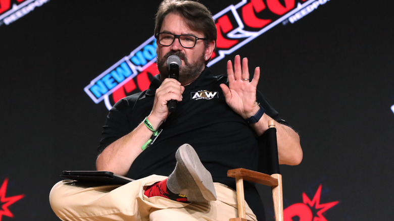 Tony Schiavone speaking into microphone