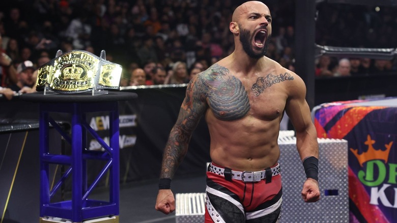 Ricochet screams beside AEW Continental Championship on "Dynamite."