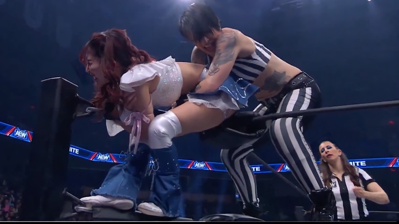 Riho and Ruby Soho grapple on the top rope