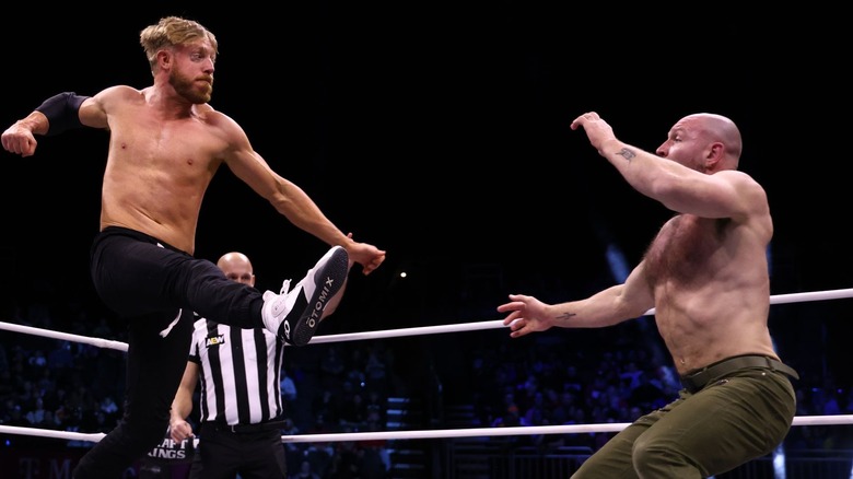 Orange Cassidy leaps at Jon Moxley