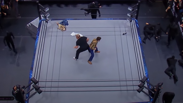 Samoa Joe and MJF hold the ring against mystery attackers