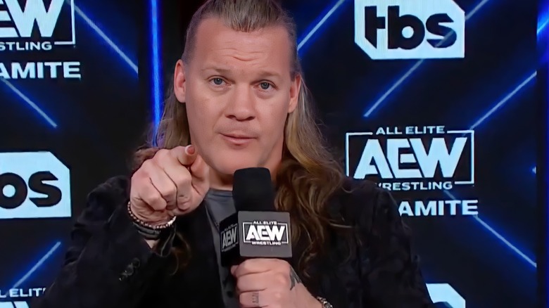 Chris Jericho points at the camera