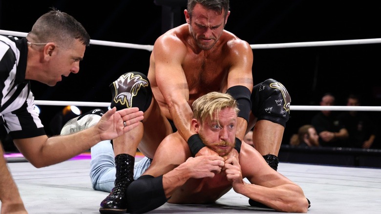 roderick strong locks in a camel clutch on orange cassidy