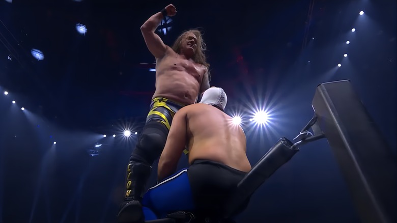 Chris Jericho punching down at Atlantis Jr.
