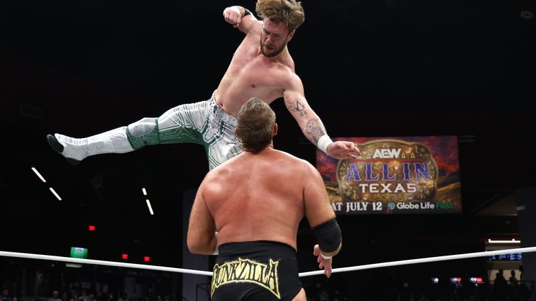 Will Ospreay delivering a flying forearm to Mark Davis