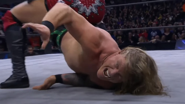 Chris Jericho grimaces in submission hold