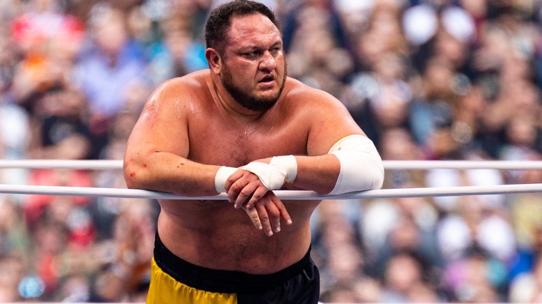 Samoa Joe leans on the ropes