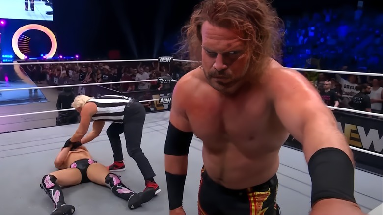 Hangman Adam Page fumes while the ref checks on Bryan Danielson