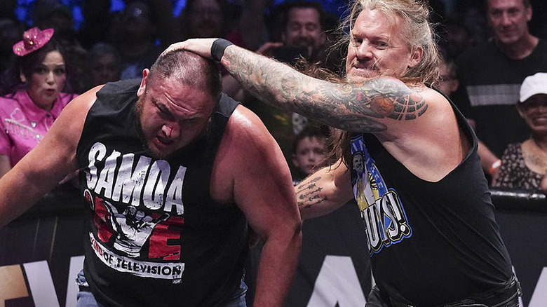 Chris Jericho grabbing Samoa Joe