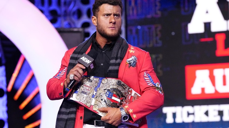 MJF holding the American title and a microphone