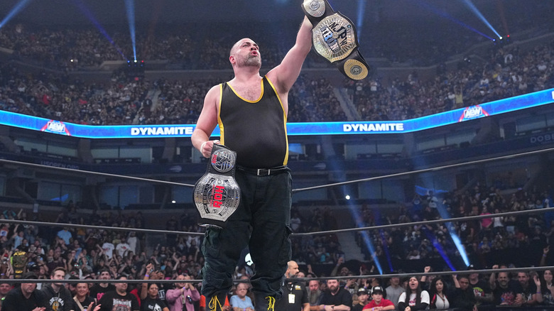 Eddie Kingston holding his titles