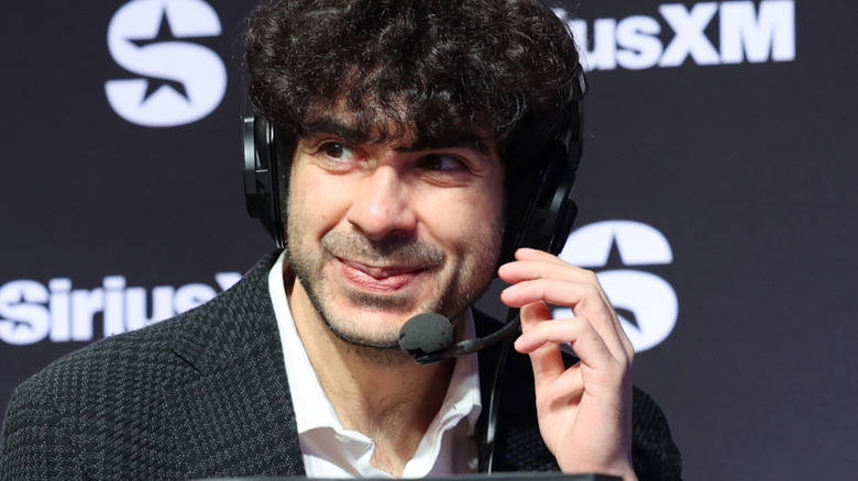 Tony Khan and Alex Marvez speak on SiriusXM at Super Bowl LVIII on February 08, 2024 in Las Vegas, Nevada.