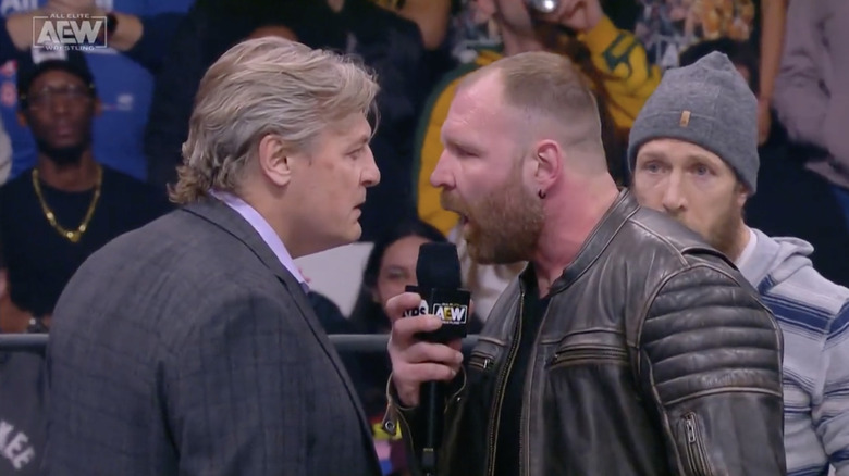 Regal and Moxley staring one another down