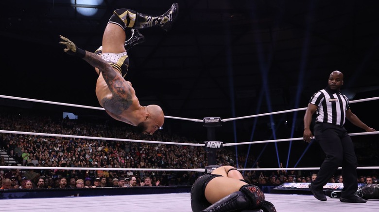 Ricochet delivers a Shooting Star Splash to Konosuke Takeshita