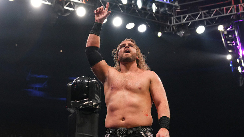 Adam Page poses on the top turnbuckle