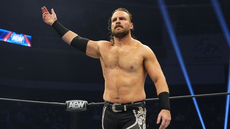 Adam Page points to the fans 