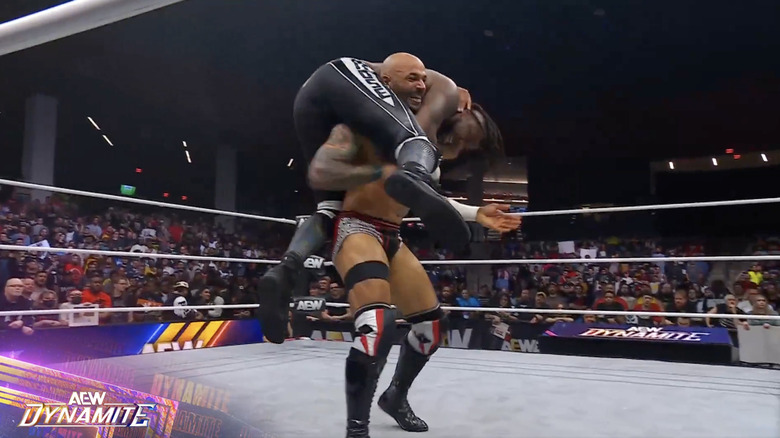 Ricochet with Strickland on his shoulders