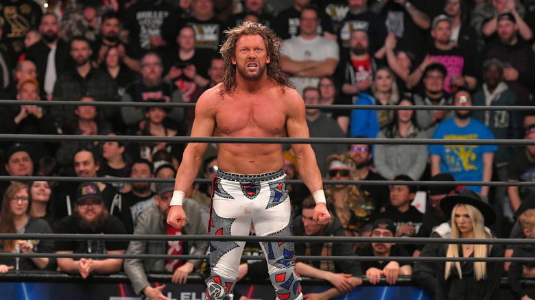 Kenny Omega poses in the ring 