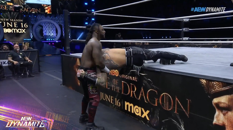 Strickland with Killswitch draped on the ring apron