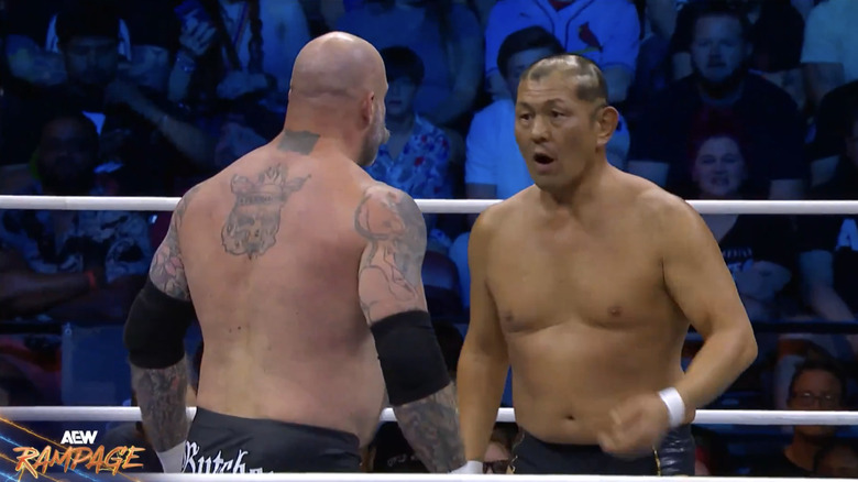 Suzuki and Butcher staring each other down in the ring