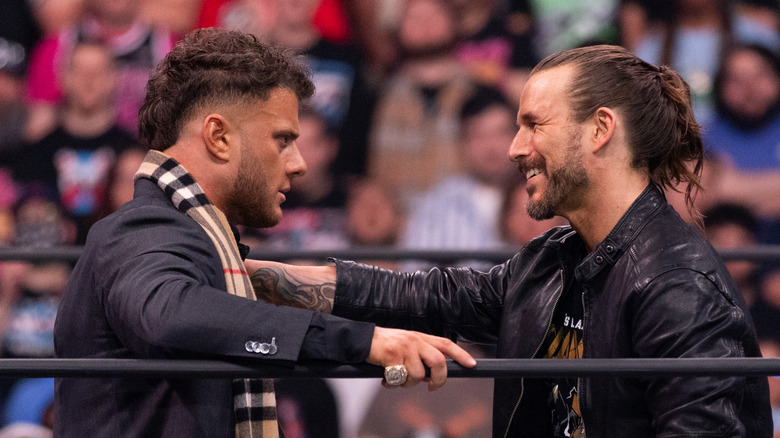 Adam Cole smiling at MJF in the ring