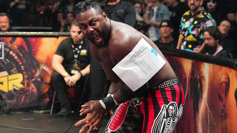 Shane Strickland has papers stapled to his arm