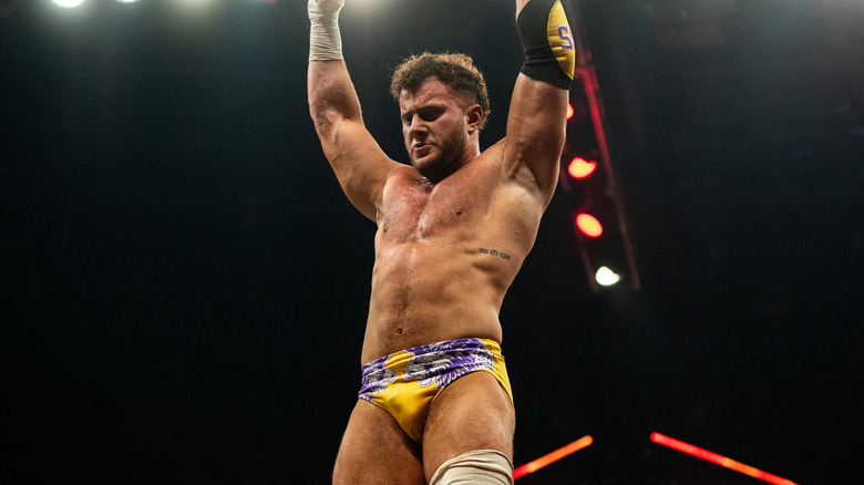 MJF looks down on his opponent before leaping off top rope