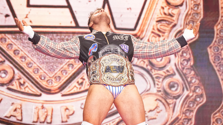 MJF spreads his arms with title belt around his waist