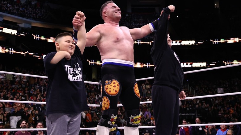 Big Boom AJ celebrates with The Rizzler and Big Justice on the AEW Full Gear Zero Hour