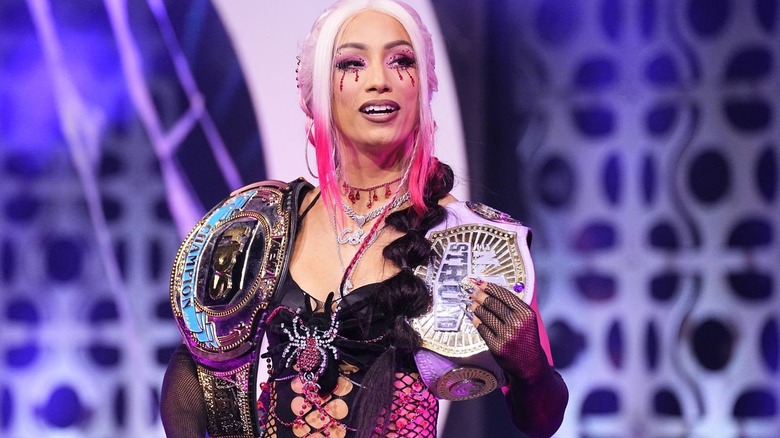 Mercedes Mone carrying both her title belts on "AEW Dynamite."